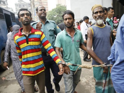 BANGLADESH, Dhaka : Bangladeshi police escort arrested men in Dhaka on June 12, 2016, who