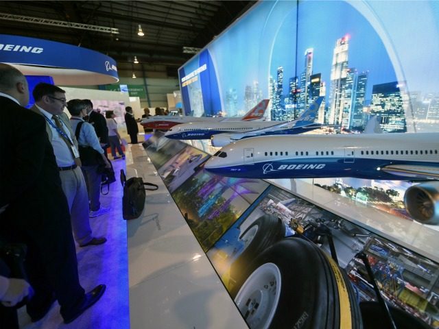 Various scale models of Boeing commercial aircraft are seen on display during the Singapore Airshow at the Changi exhibition centre in Singapore on February 16, 2016.