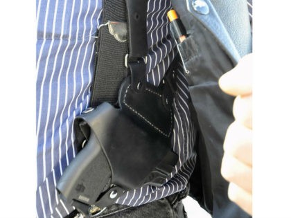 FILE - In this Jan. 2, 2012 file photo, a small handgun is seen under a vest in High Point, N.C. Dealing a blow to gun supporters, a federal appeals court ruled Thursday, June 9, 2016, that Americans do not have a constitutional right to carry concealed weapons in public. …