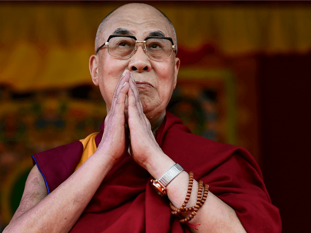 The Dalai Lama takes to the stage to address the faithful in Aldershot on June 29, 2015 wh