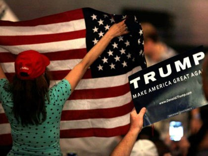 Supporters cheer as they wait for US Republican presidential candidate Donald Trump to spe