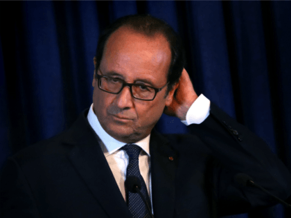French President Francois Hollande looks on during a joint press conference with Iraqi Kurdish leader Massud Barzani in Arbil, the capital of the Kurdish autonomous region in northern Iraq, on September 12, 2014.