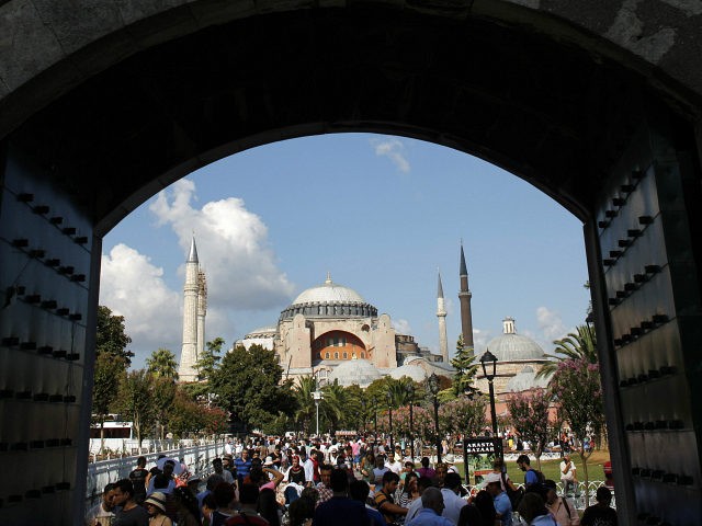 Local and foreign visitors, with the Byzantine-era monument of Hagia Sophia in the backgro
