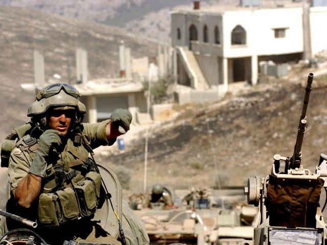 In this photo released by the Israel Defense Forces (IDF), Israeli troops operate against Hezbollah militants July 29, 2006 in the south Lebanese village of Marun al-Ras. The Israeli Government refused a UN request July 29 for a 72 hour truce in Southern Lebanon for humanitarian efforts, citing a corridor …