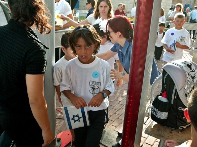 RAMLA, ISRAEL - SEPTEMBER 1: Israeli schoolchildren pass through a metal detector on their