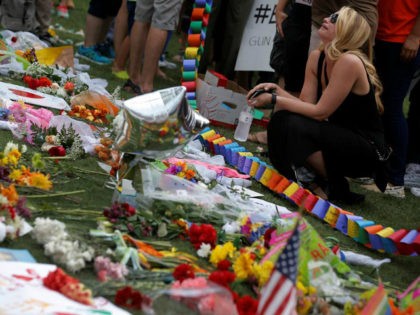 A woman cries at a vigil in Orlando, Florida, June 13, 2016. REUTERS/Jim Young