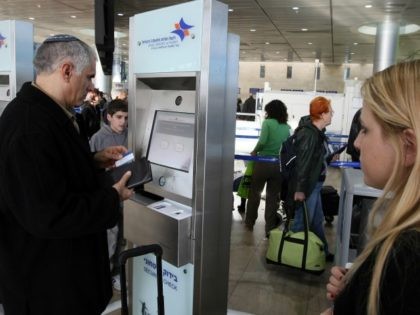 Passengers check-in using a new security machine as part of measures to increase security at Israel's Ben-Gurion International Airport near Tel Aviv on January 05, 2010.