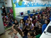 siren drill israel Israeli schoolchildren gather in a bomb shelter at a school in Jerusalem after sirens sounded across Israel as part of country-wide massive civil defence exercise aimed at preparing the country for air or missile attacks involving non-conventional weapons on June 2, 2015. AFP PHOTO / MENAHEM KAHANA (Photo credit should …