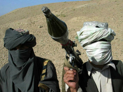 Face-covered militants who they say are Talibans pose with an RPG in Zabul province, southern of Kabul, Afghanistan Saturday, Oct. 7, 2006. A Taliban commander said in a sit-down interview that insurgent fighters will battle "Christian" troops until they leave Afghanistan and a fundamentalist government is established in Kabul, warning …