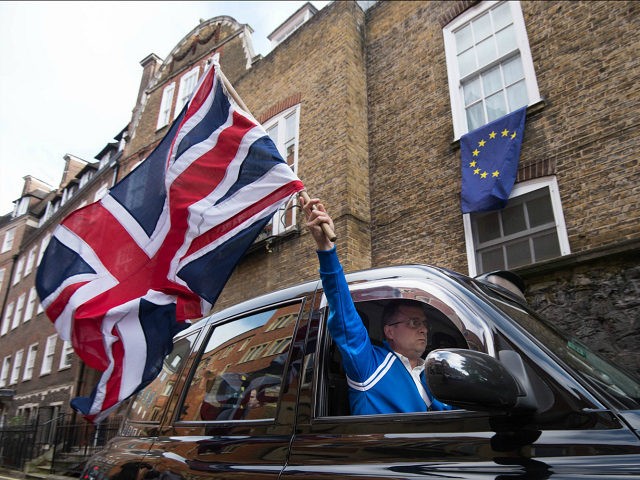 EU referendum. A London taxi driver waves a Union Jack flag in Westminster, London after Britain voted to leave the European Union in an historic referendum which has thrown Westminster politics into disarray and sent the pound tumbling on the world markets. Picture date: Friday June 24, 2016. See PA …