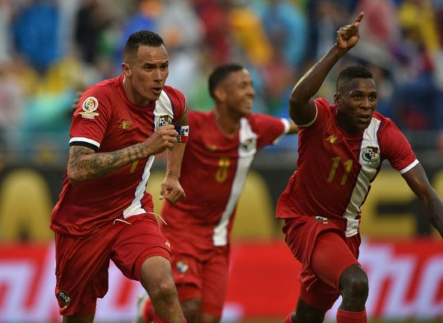 Panama's Blas Perez Ortega (L) celebrates with teammates after scoring against Bolivia dur