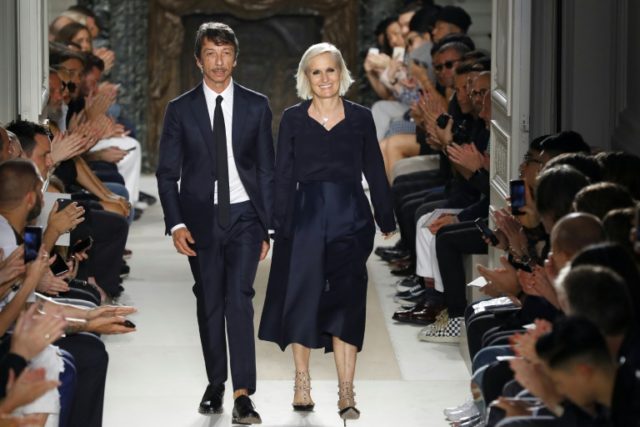 Italian fashion designers Maria Grazia Chiuri (R) and Pier Paolo Picciolo for Valentino ac