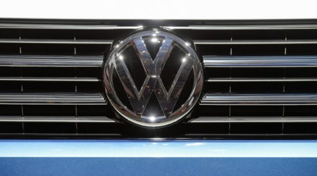 A Volkswagen logo is seen on a VW Multivan on display during German carmaker Volkswagen sh
