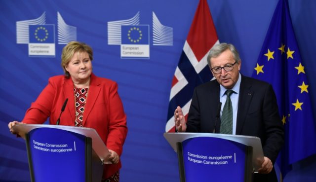 European Commission President Jean-Claude Juncker (R) welcomes Norwegian Prime Minister Er