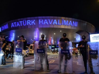 Turkish police officers block the main entrance of the Ataturk airport in Istanbul on June