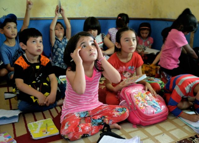 Refugee children attend a school in Cisarua, West Java, in a mountainous area south of Jak