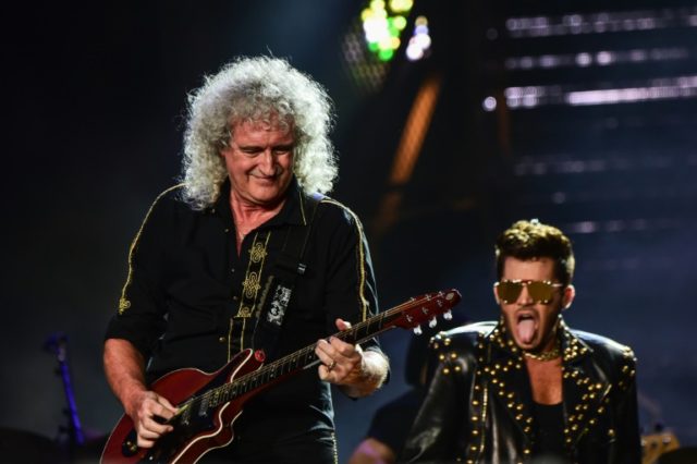 Brian May (L) of British rock band Queen, pictured performing with singer Adam Lambert on