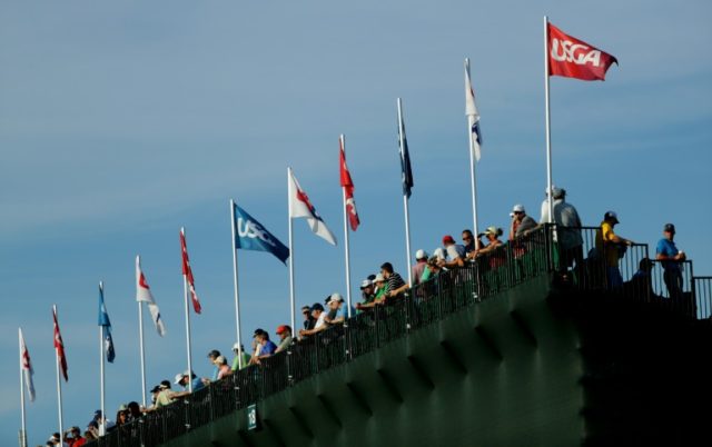 Fans watch from the grandstands on the 17th hole at Oakmont Country Club on June 19, 2016