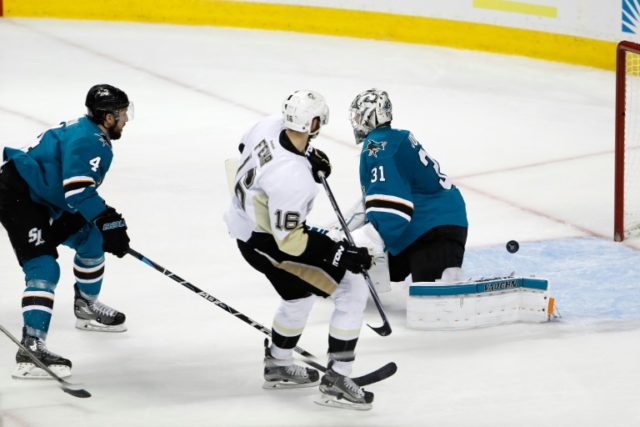 Goalkeeper Martin Jones of the San Jose Sharks allows a goal to Eric Fehr of the Pittsburg