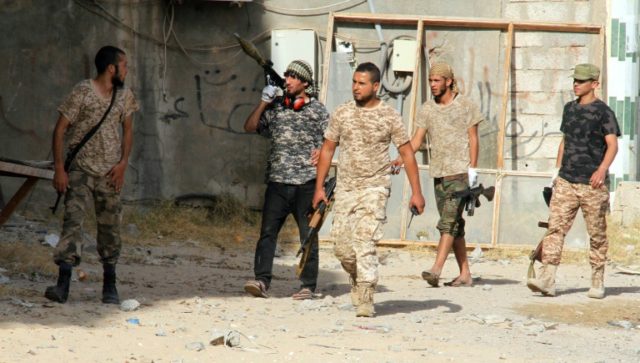 Forces loyal to Libya's UN-backed unity government patrol the city of Sirte during an oper