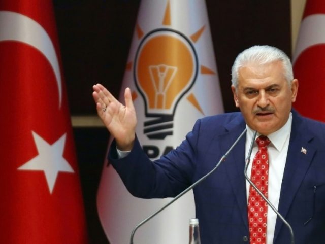 Turkish Prime Minister Binali Yildirim addresses a meeting of the ruling Justice and Devel