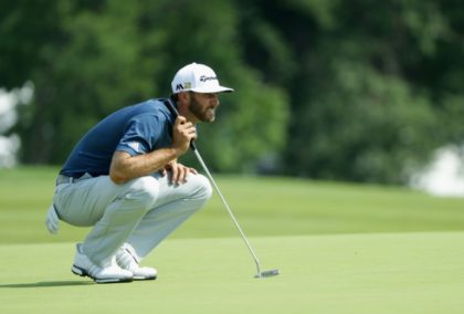 Dustin Johnson of the United States lines up a putt on June 19, 2016 in Oakmont, Pennsylva