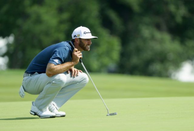 Dustin Johnson of the United States lines up a putt on June 19, 2016 in Oakmont, Pennsylva