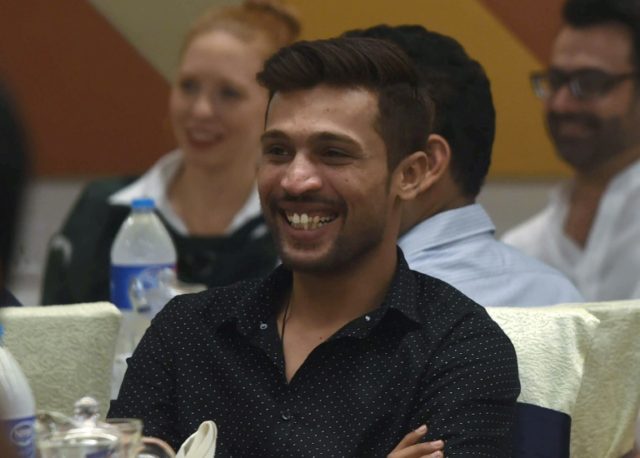 Pakistani cricketer Mohammad Amir smiles at an Iftar dinner in Lahore, hosted by the Briti