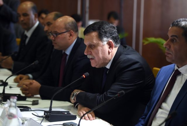 Libyan Prime Minister Fayez al-Sarraj (2nd R) said the presence of foreign ground troops t