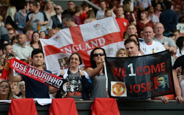 Fans welcome Manchester United's new coach Jose Mourinho before the Soccer Aid charity foo