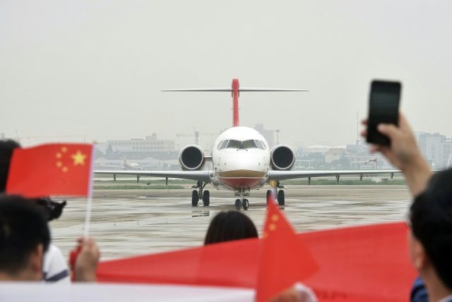 China's first domestic regional jet ARJ21 arrives at Shanghai Hongqiao Airport after makin