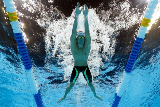 Michael Phelps competes in a heat for the men's 200m individual medley at the US Olympic s