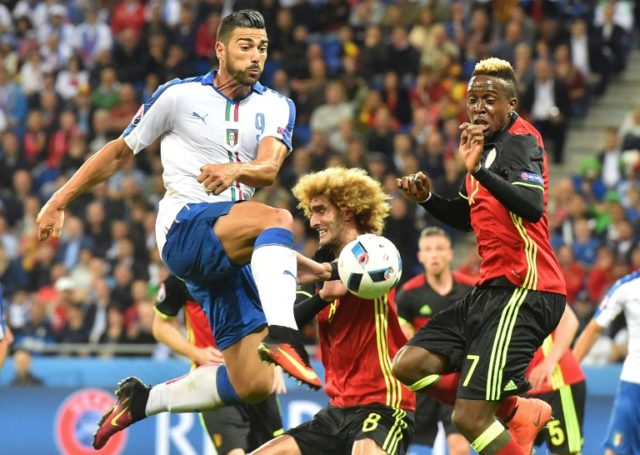 Italy's forward Pelle (L) vies with Belgium's midfielder Kevin De Bruyne (R) during the Eu