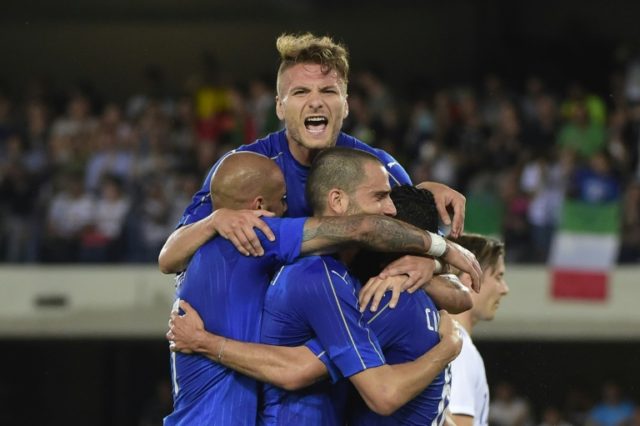 Italy's midfieldrer Antonio Candreva (R) celebrates with teammates Ciro Immobile (top) and