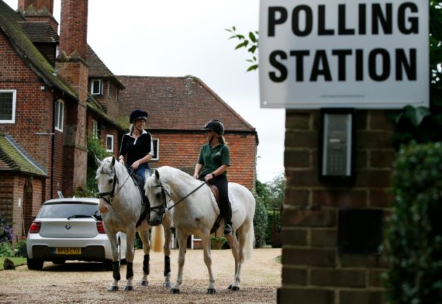 Jacqui Vaughan (left) and Sophie Allison, riding horses Splash and Sharna outside a pollin