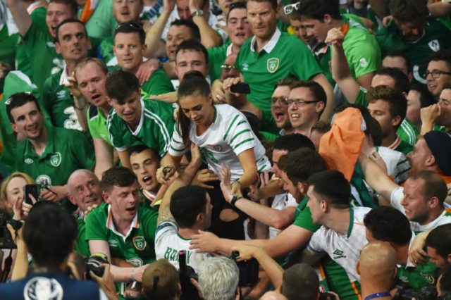 Ireland's midfielder Robert Brady greets his partner Kerrie Harris after the Euro 2016 gro