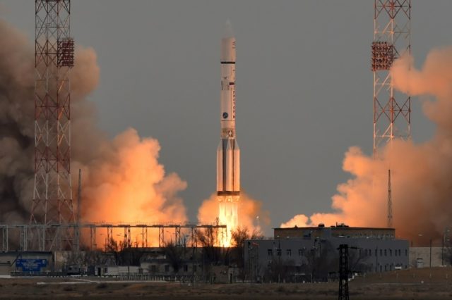 A Russian Proton-M rocket carrying the ExoMars 2016 spacecraft blasts off from the launch