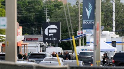 Orlando police officers are seen outside of Pulse nightclub after a fatal shooting and hos
