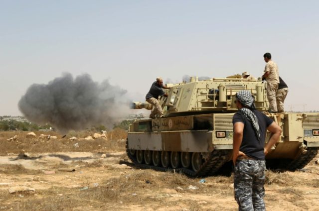 Forces loyal to Libya's UN-backed unity government fire from a tank in Sirte's centre towa