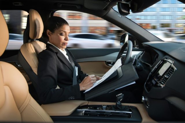 This picture provided by Swedish carmaker Volvo shows a woman reading inside a so-called a