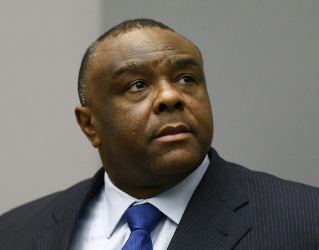 Former Congolese vice president Jean-Pierre Bemba sits in a courtroom at the International