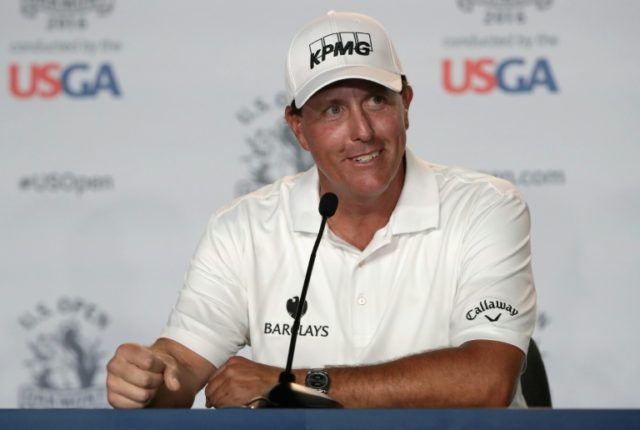 Phil Mickelson of the United States speaks to the press after a practice round prior to th