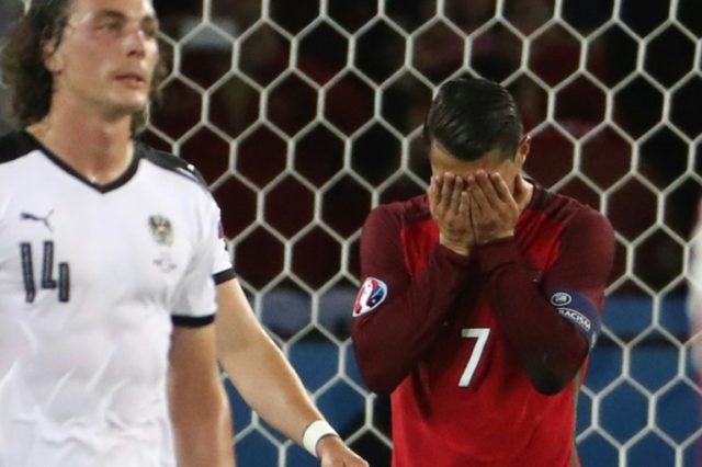 Portugal forward Cristiano Ronaldo (right) reacts after missing a penalty against Austria