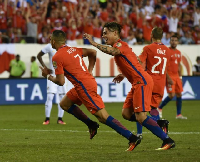 Chile's Alexis Sanchez (L) celebrates with teammate Eduardo Vargas after scoring against P
