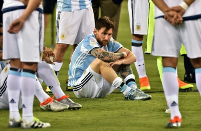Argentina's Lionel Messi waits to receive the second place medal during the Copa America C