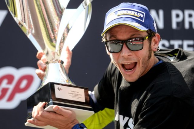 First-placed Valentino Rossi celebrates on the podium of the Catalunya Grand Prix on June