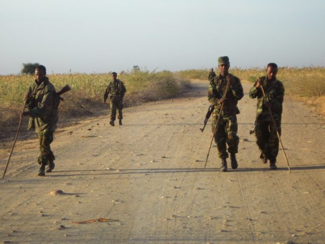 Ethiopian soldiers check for landmines on a road leading to the eastern Ethiopian-Eritrean