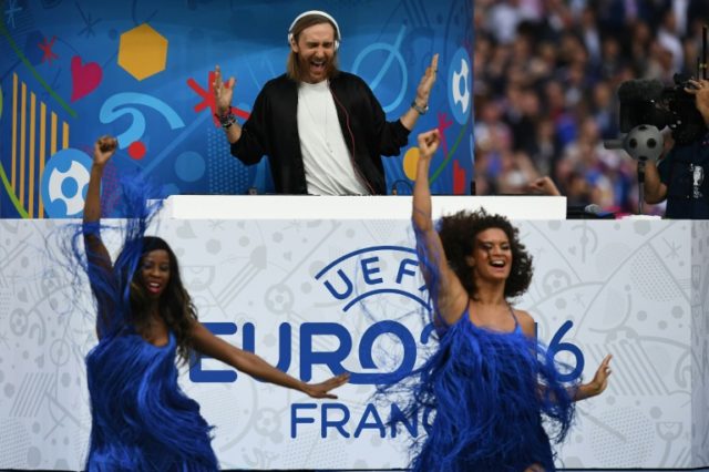 French DJ David Guetta performs during the opening ceremony prior to the Euro 2016 group A