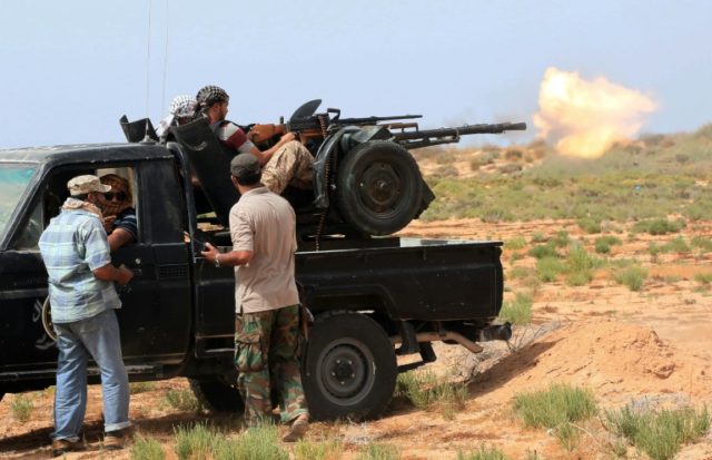 Forces loyal to Libya's UN-backed unity government fire during clashes with jihadists of t