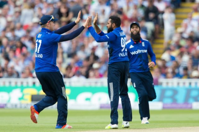 England's Adil Rashid (C) celebrates with teammates after taking the wicket of Sri Lanka's